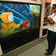 Donna Carter watches an HDTV monitor Sept. 20, 2000 at Douglas TV-Big Screen Store in Mount Prospect, IL.